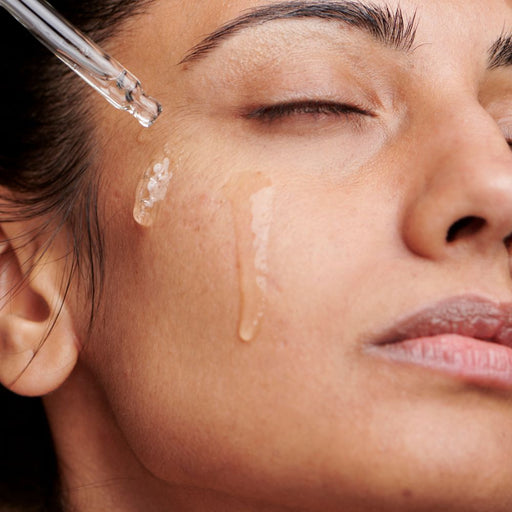Model applying serum for texture and enlarged pores skincare