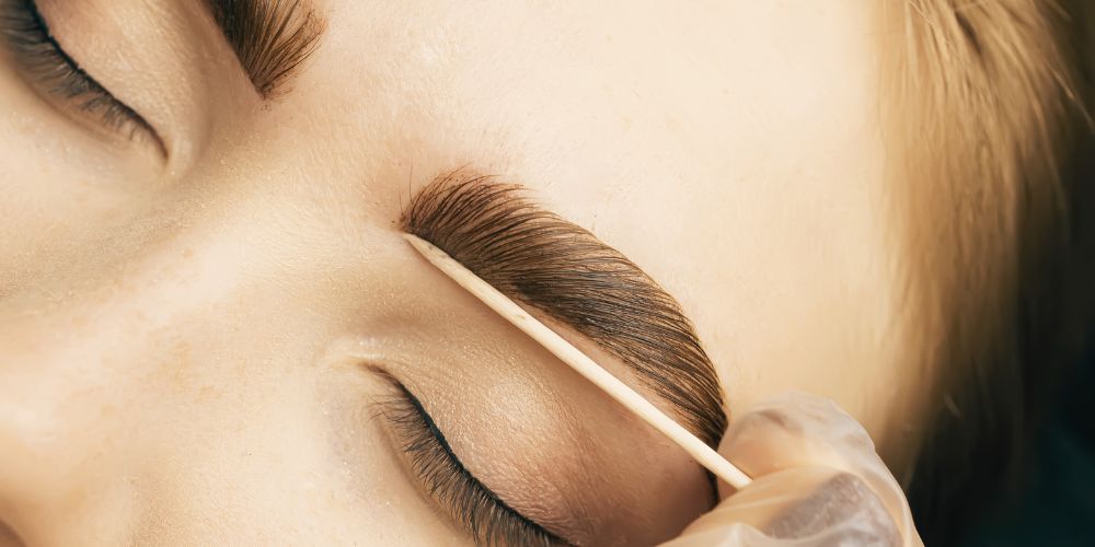 Lash or brow tinting procedure close up full brows